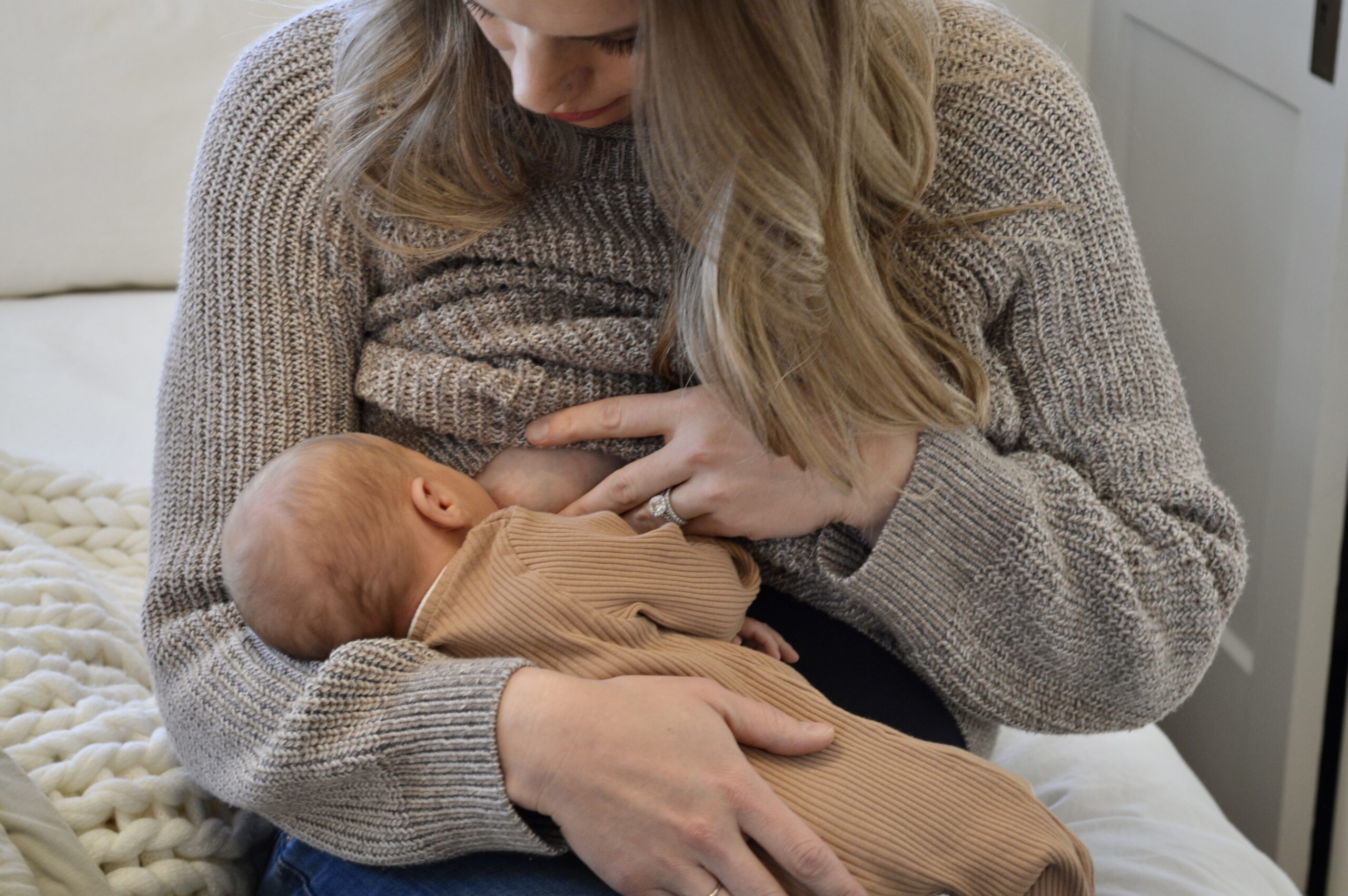 mom breastfeeding newborn