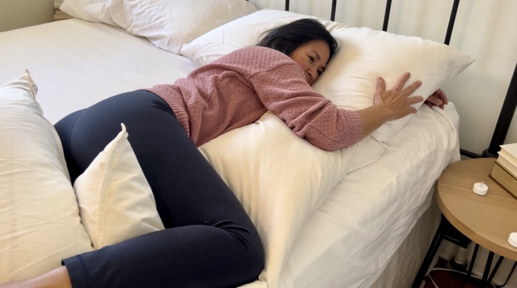 Woman in side lying release trying to induce labor with natural interventions