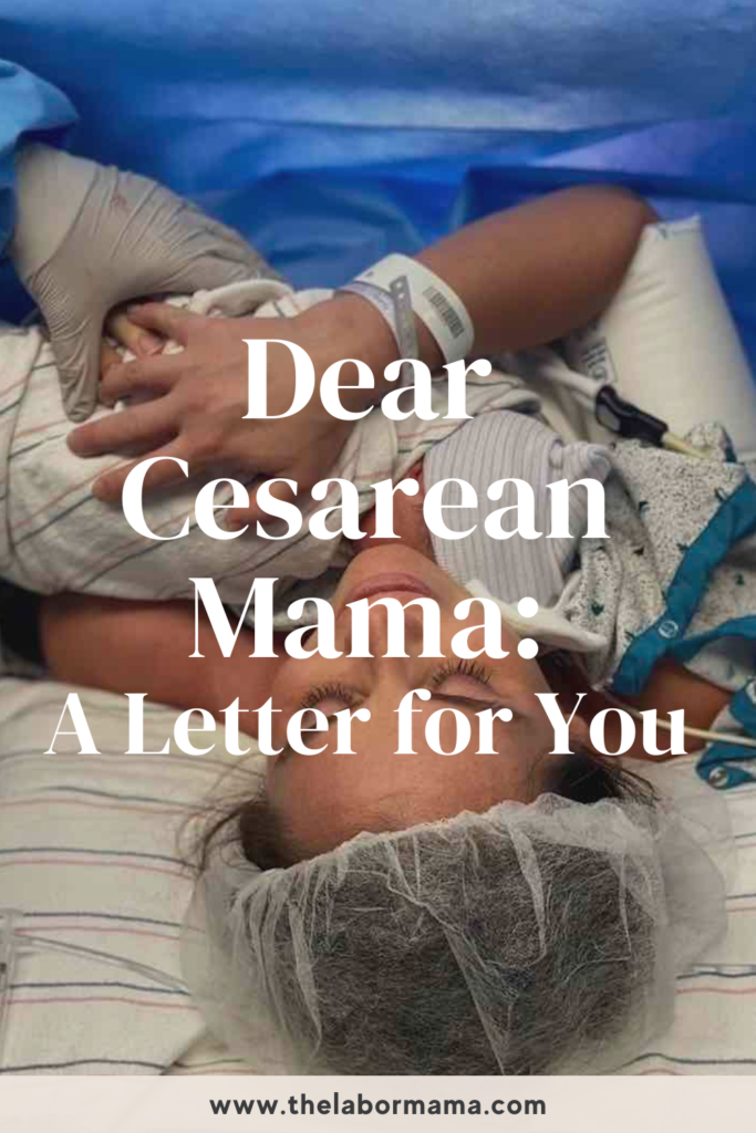 mother in operating room holding baby after cesarean