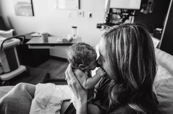 newborn baby with mother in hospital birth