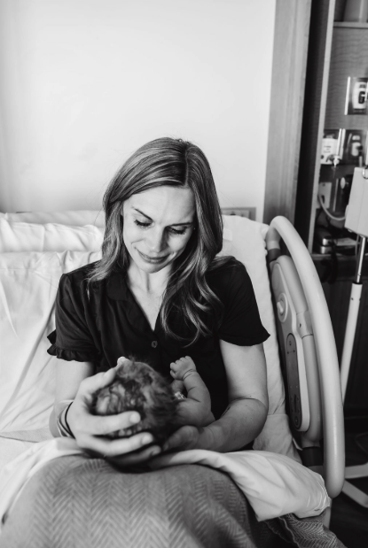 newborn baby with mother in hospital birth