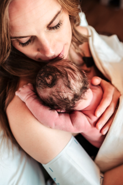 newborn baby with mother in hospital birth