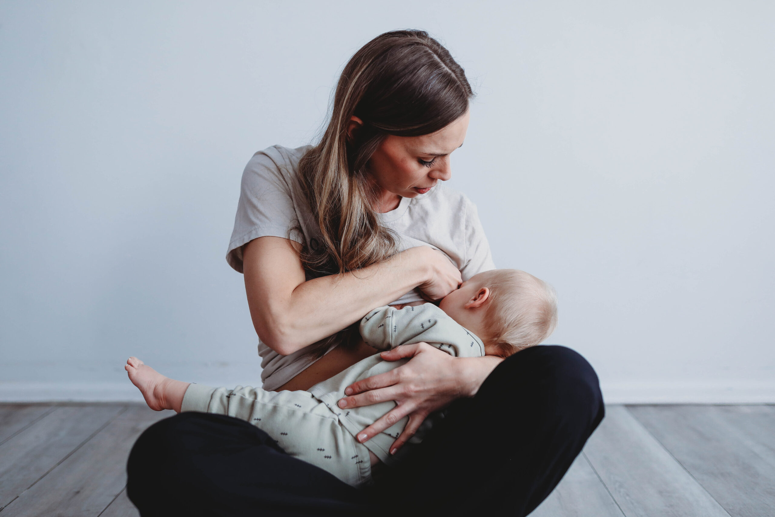 a mom breastfeeding their baby